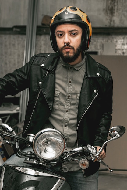 Man with leather jacket on motorcycle