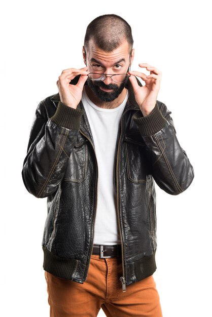 Man with leather jacket showing something