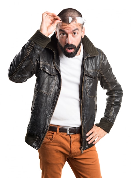 Man with leather jacket showing something