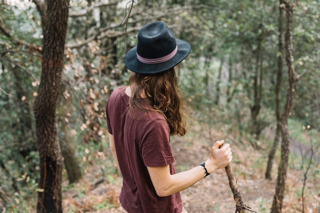 Man with long hair hiking in nature