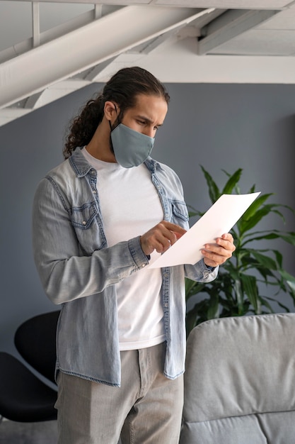 Man with medical mask working