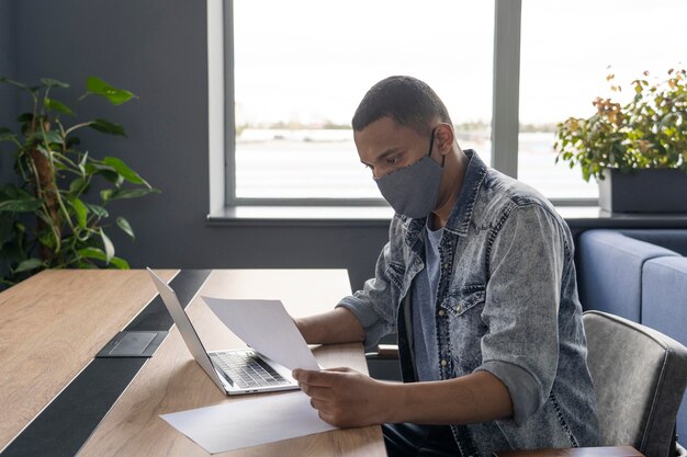 Man with medical mask working