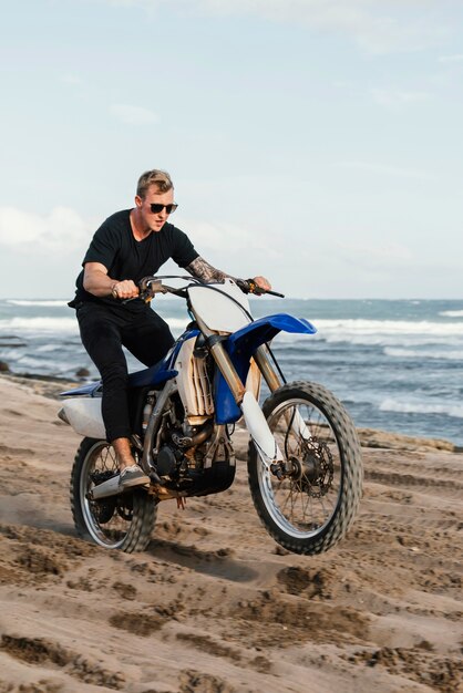 Man with motorcycle in hawaii