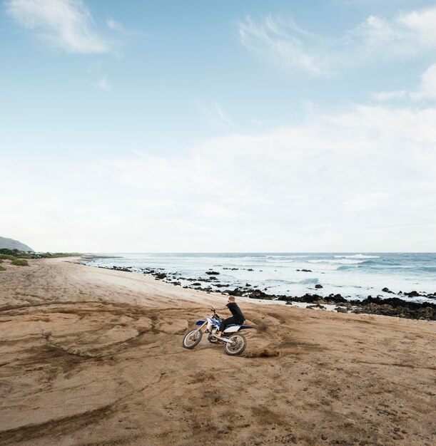 Man with motorcycle in hawaii