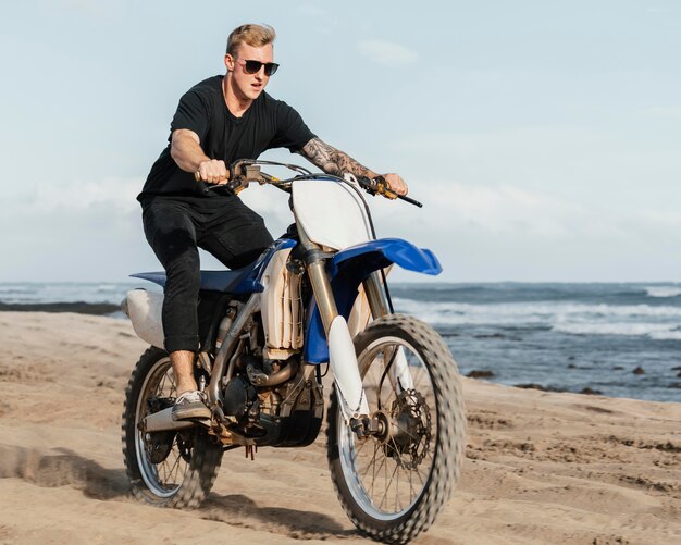 Man with motorcycle in hawaii