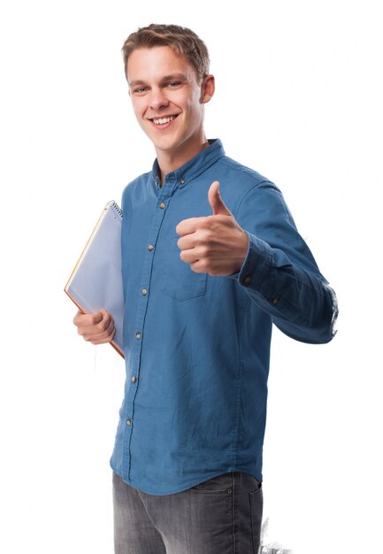 Man with a notebook and thumb up