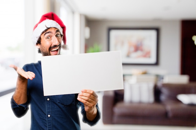 Free photo man with open mouth and large sign in a house