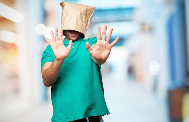 Man with a paper bag on his head