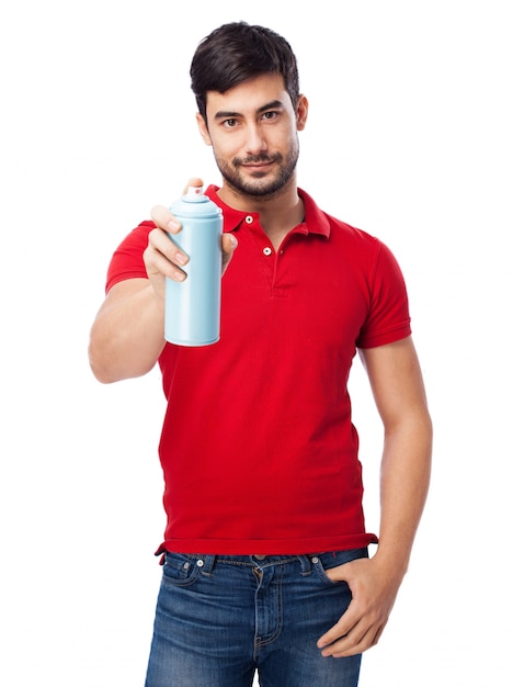 Man with red sweater holding a spray can