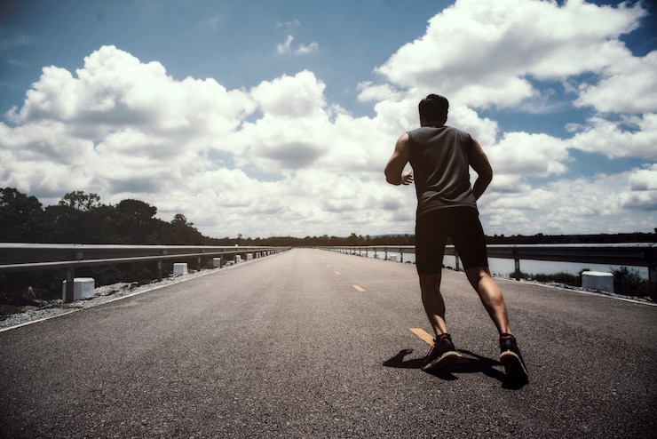 Free Photo the man with runner on the street