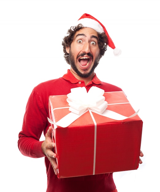 Человек в шляпе Санта Клауса с подарком