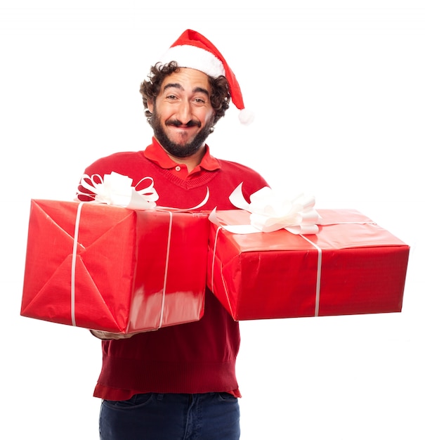 多くの贈り物サンタの帽子を持つ男
