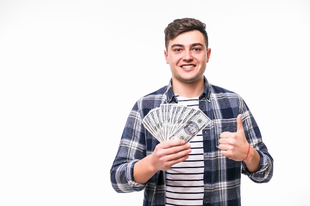 Man with short dark hair hold fan of money in right hand