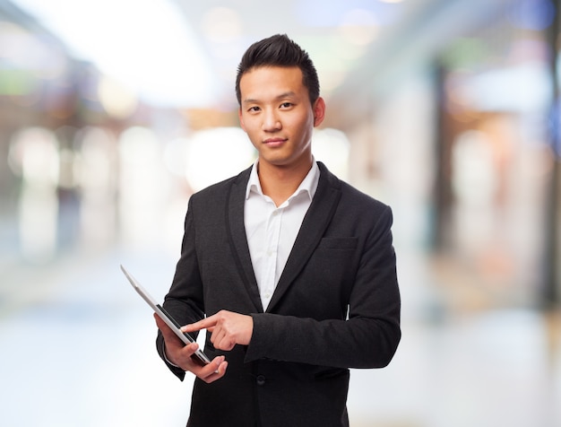 Man with a suit in a shopping center