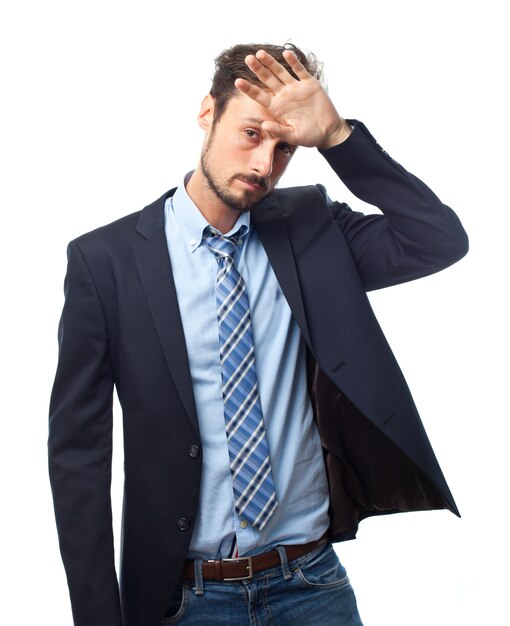 Man with suit with a hand on forehead