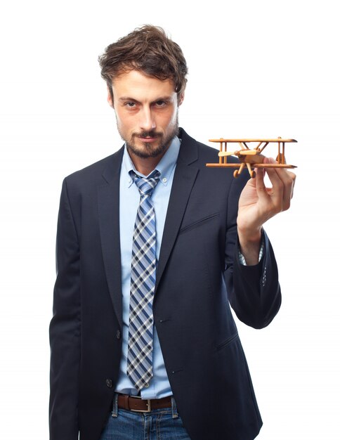 Man with suit and a wooden plane