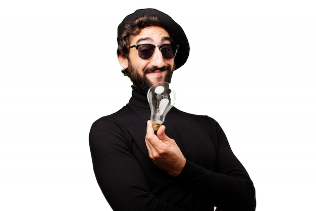 Free photo man with sunglasses and beret with a light bulb