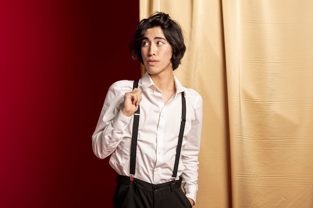 Man with suspenders posing for chinese new year