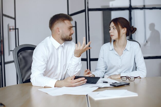 Man with a tablet. Business partners at a business meeting.People sitting at the table