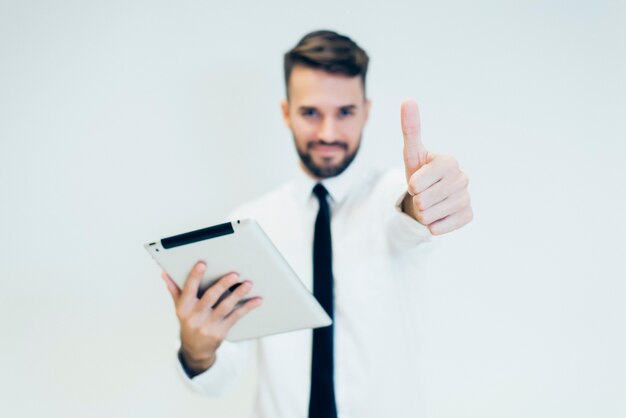 Man with a tablet and thumbs up