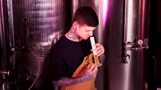 Man with tattoos producing craft beer