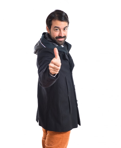 Man with thumb up over white background