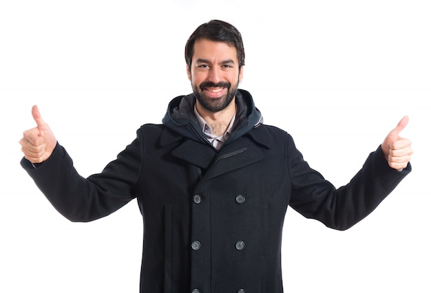 Man with thumb up over white background