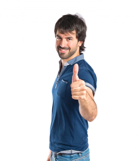 Man with thumb up over white background