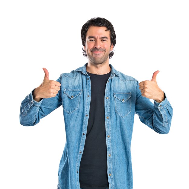 Man with thumb up over white background