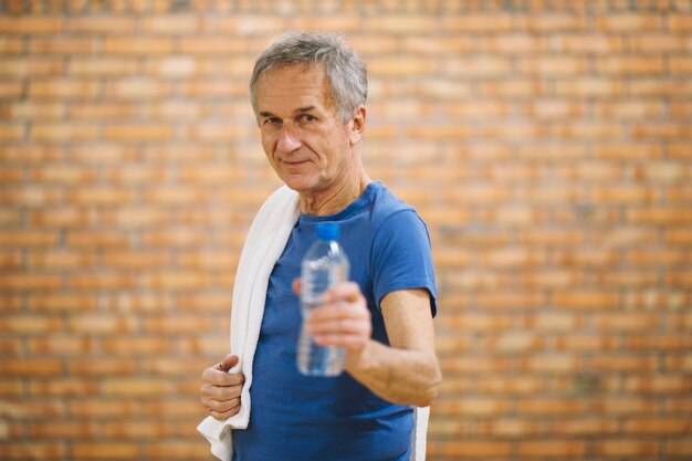 Man with towel and water