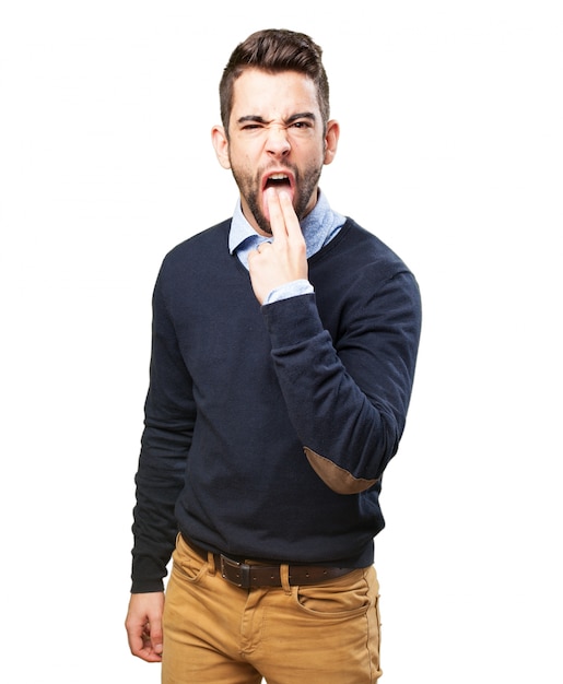 Man with two fingers in his mouth