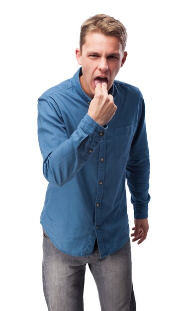 Man with two fingers in mouth