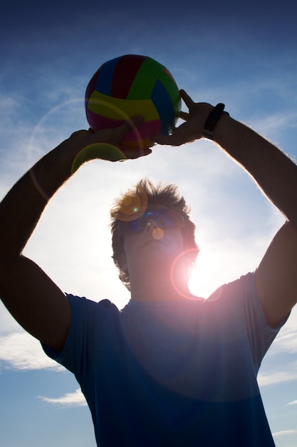 Free photo man with volleyball ball