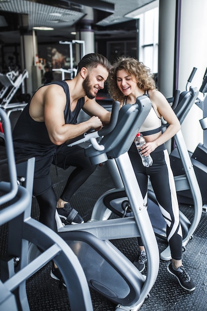 A man and a woman are watching a training video