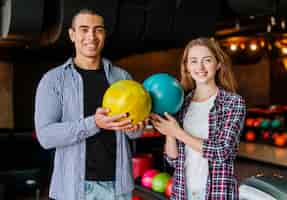 Free photo man and woman in a bowling club