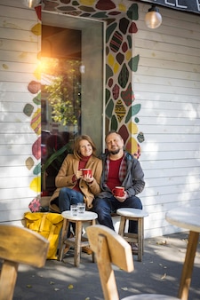 Man and a woman in a cafe drinking coffee