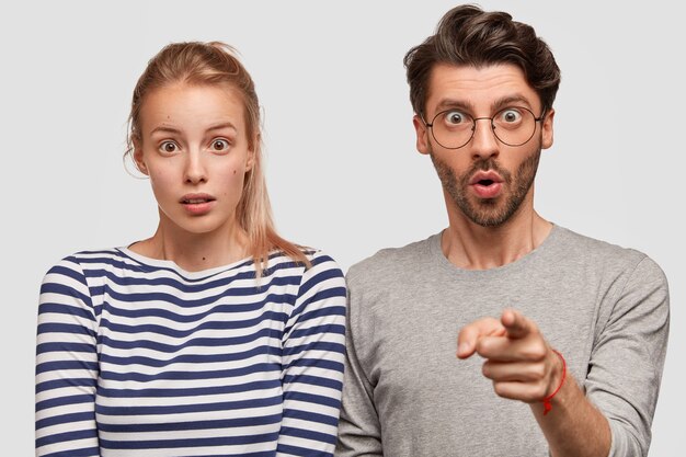 Man and woman in casual clothes posing