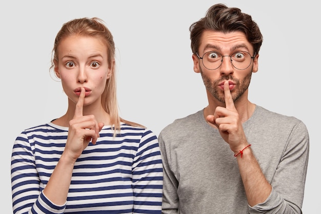 Man and woman in casual clothes posing