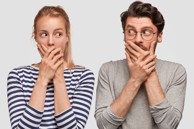 Man and woman in casual clothes posing