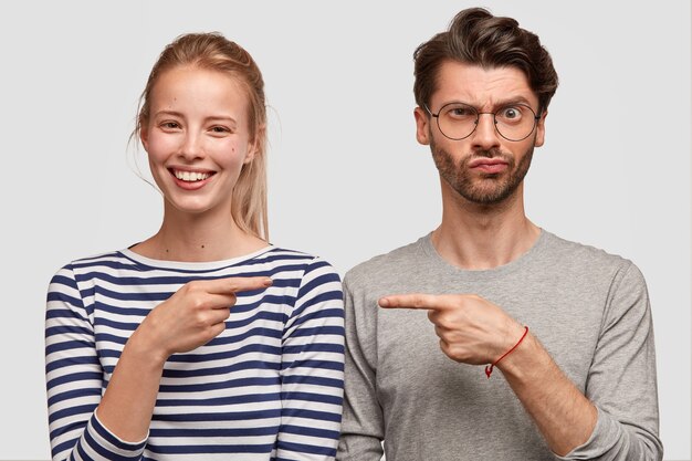 man and woman in casual clothes posing