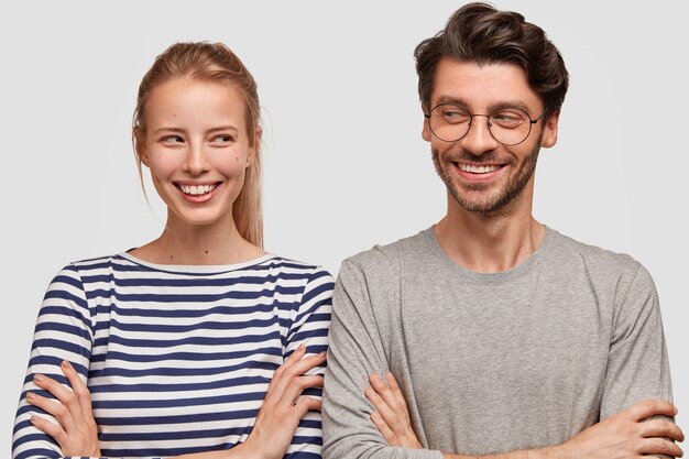 man and woman in casual clothes posing