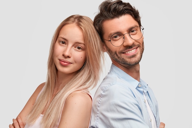 Man and woman in casual clothes posing