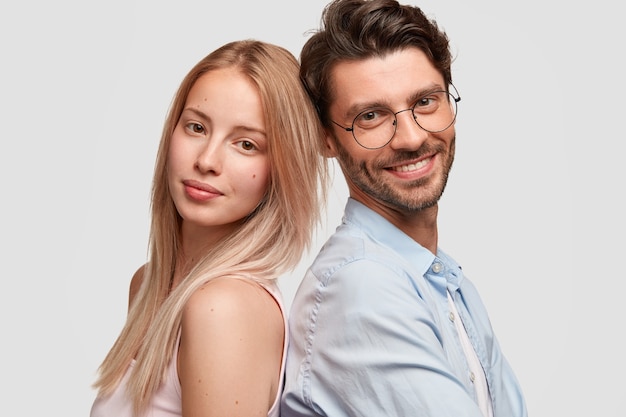 Free photo man and woman in casual clothes posing