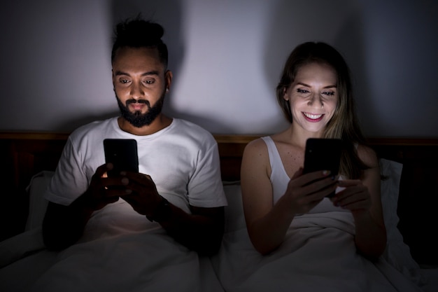 man-woman-checking-their-phone-before-sl