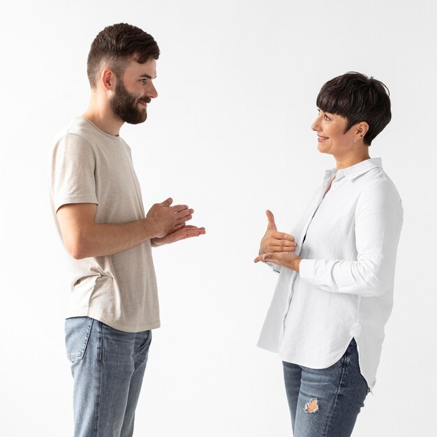 Man and woman communicating through sign language