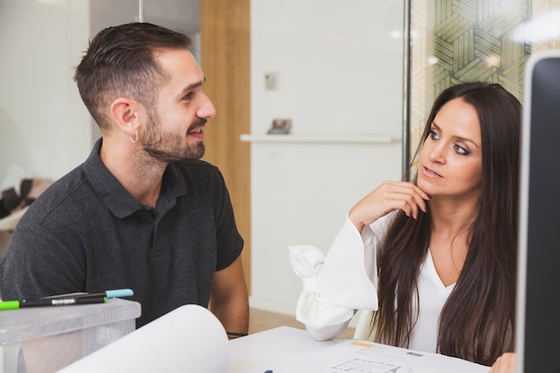 Man and woman coworking in office together