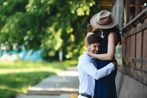 Man and woman embracing each other in the park