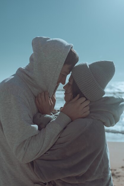 Man and woman enjoy each other in the beach