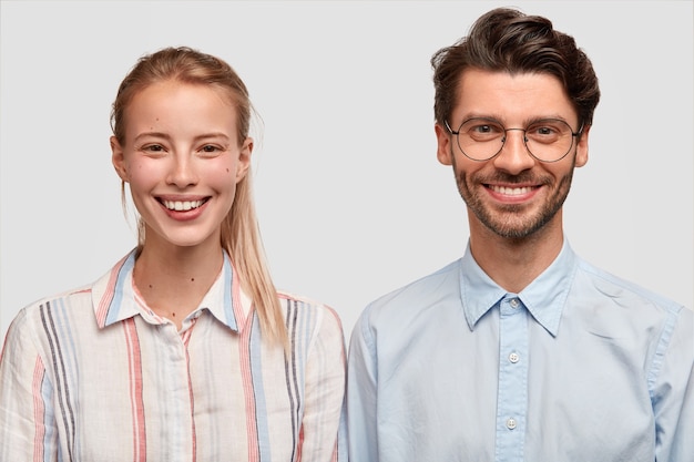 Free photo man and woman in formal clothes posing