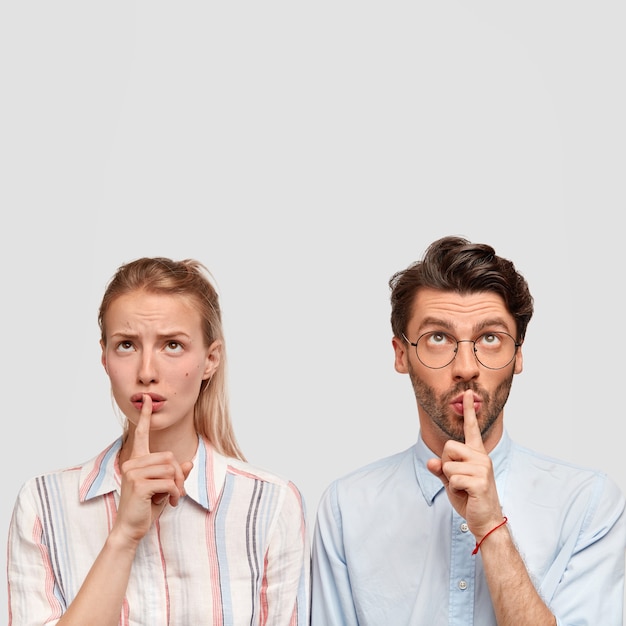 Man and woman in formal clothes posing